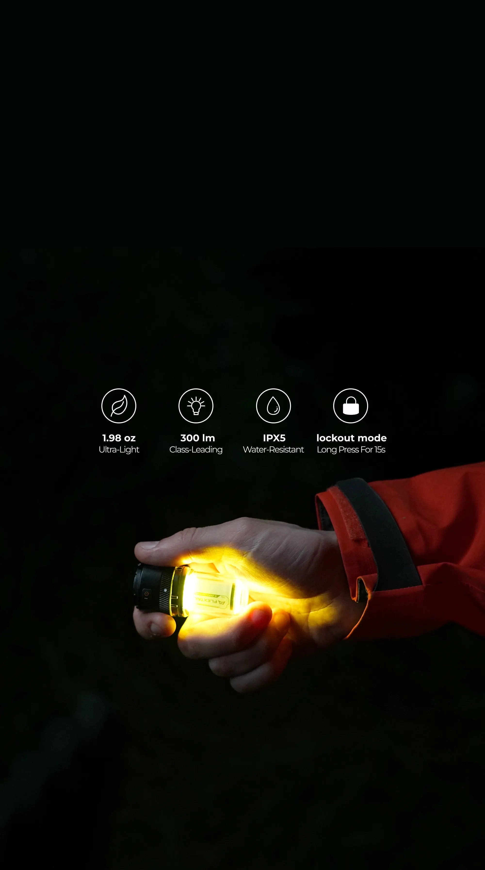 A lantern glowing in the dark held by a hand